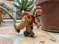 RARE 1950 CLOWN ON ROLLER