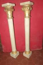 Pair of painted and gilded wooden columns, early 19th century period.