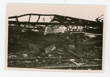 PHOTO, warehouse hangar metal structure rail fire bombing