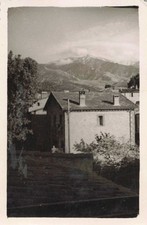 OLD PHOTOGRAPH HOUSE AT THE FOOT OF THE MOUNTAINS