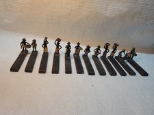 12 portes couteaux africain  anciens en bronze peint