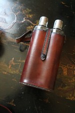 old whiskey alcohol glass bottle holder with leather case