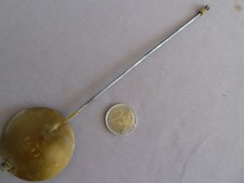 Ancien balancier de pendule en laiton