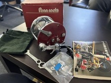 Penn reel with instructions and accessories