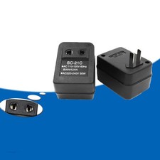 Adaptateur De Tension