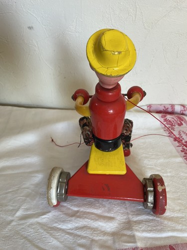 Ancien jouet clown tricycle