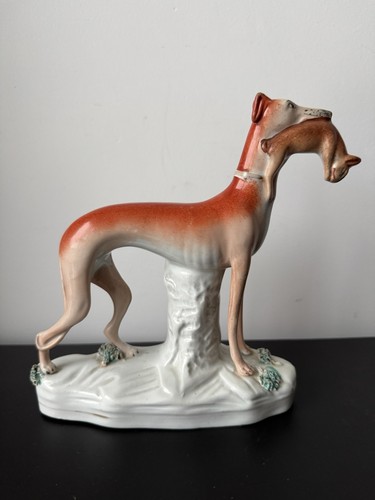 Statue chien en - de,