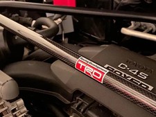 BARRE DE TOUR DE JAMBE DE FORCE AVANT EN CARBONE VÉRITABLE TOYOTA TRD OEM...