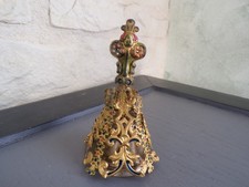 Bronze table bell covered in polychrome brass