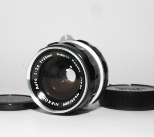 Comme neuf objectif - neuf],