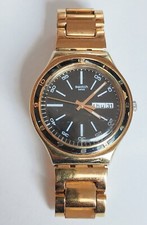 Montre Swatch Unisex Irony Charcoal Gold Rose. Bon état. Pile Neuve