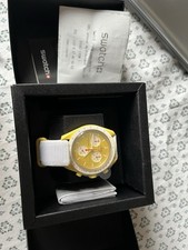 swatch omega gold