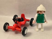 Nice child with Playmobil kart (bike, park) 0084
