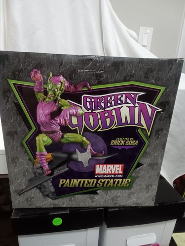 Green goblin painted statue